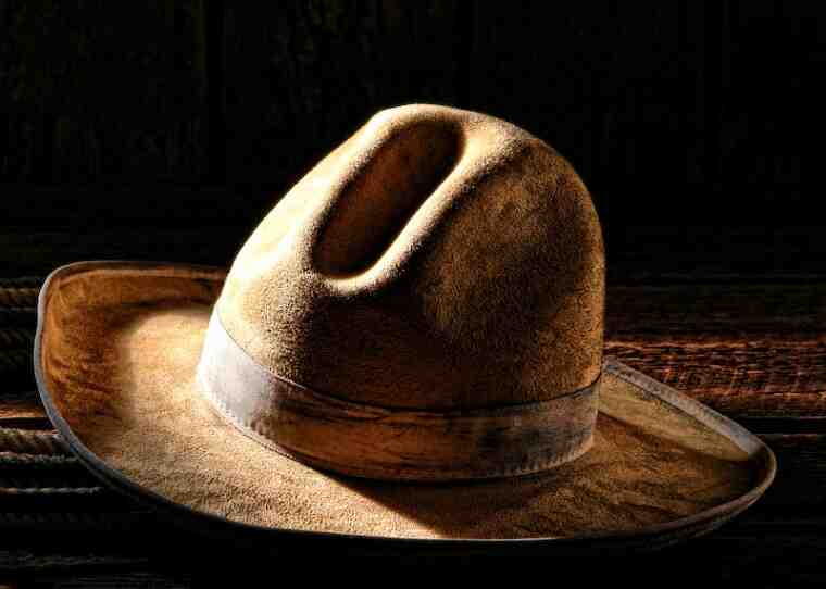 How far above your ears should a cowboy hat be?