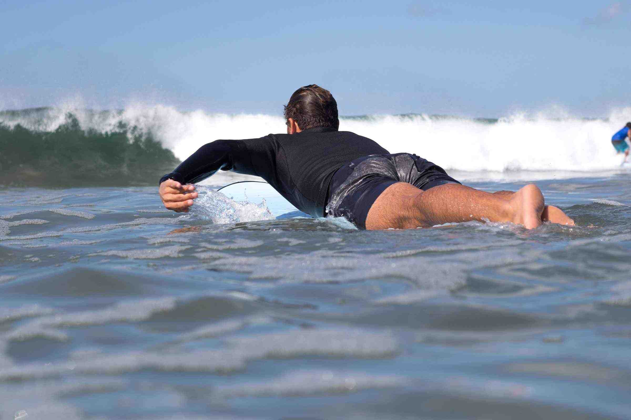 Why do surfers wax their boards?