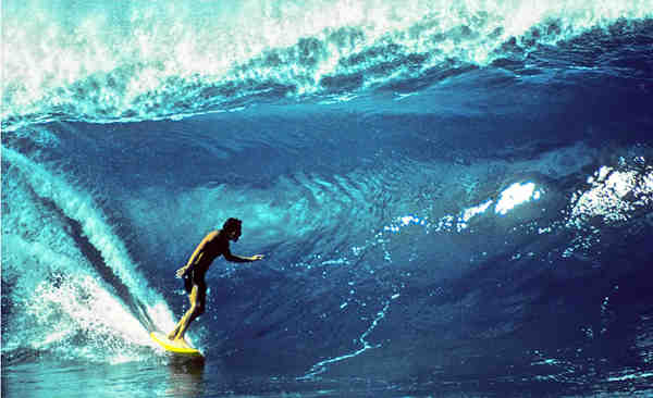 Who surfed the first 100-foot wave?