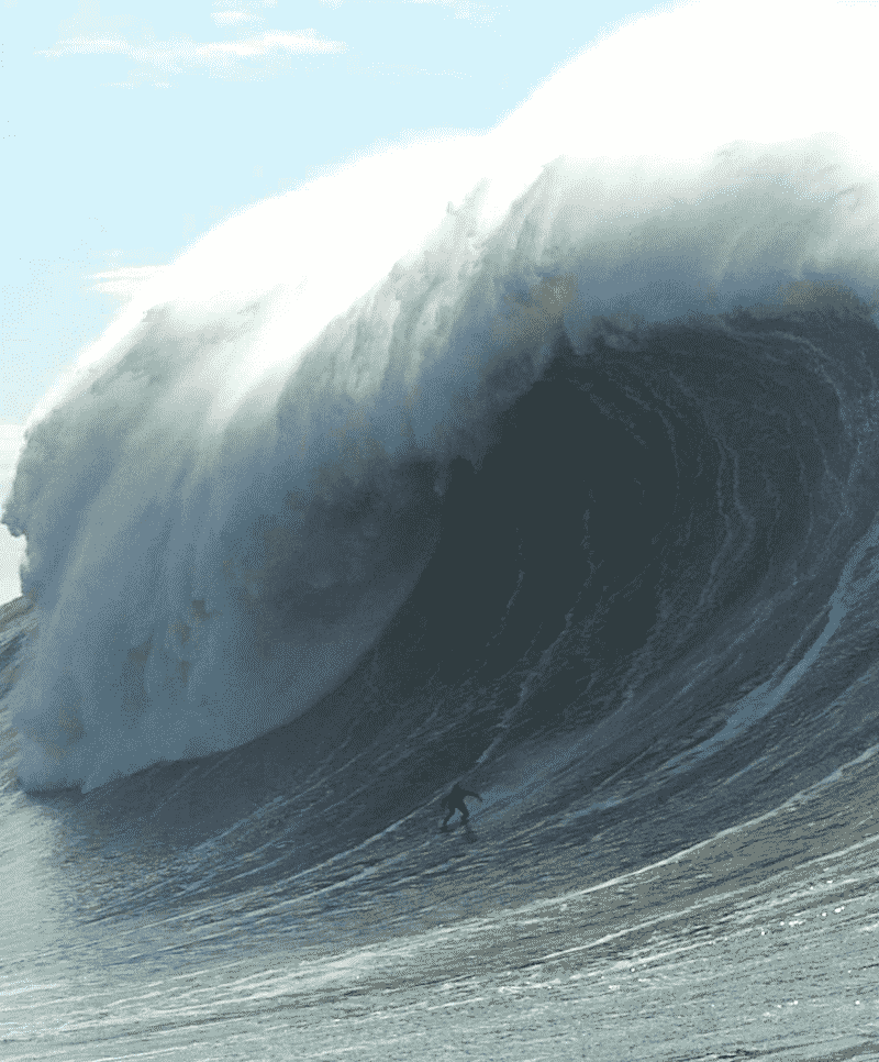 Who surfed the first 100 foot wave?