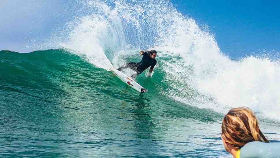 Does Garrett surf a 100 foot wave?