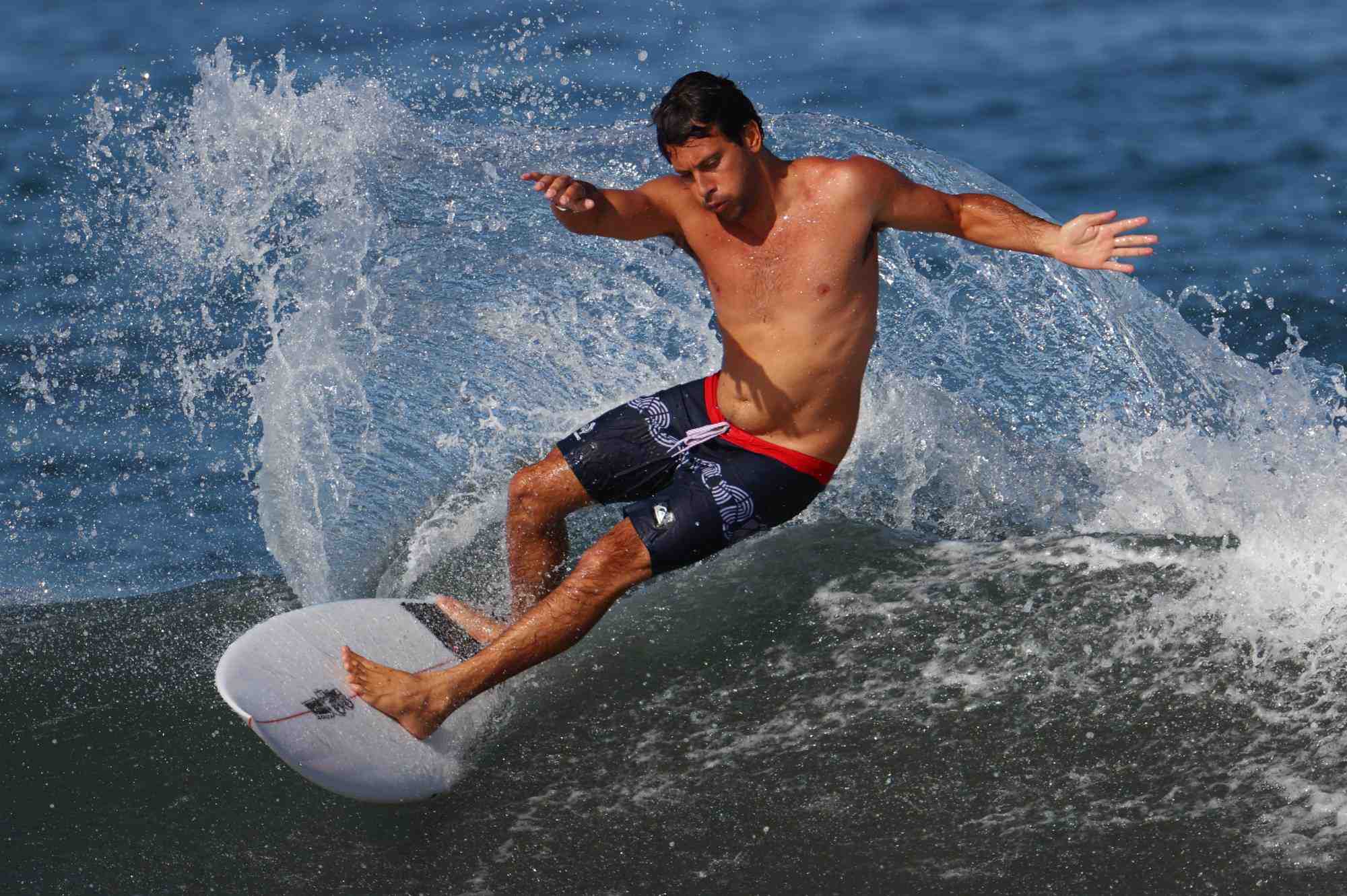 How do surfers survive big waves?
