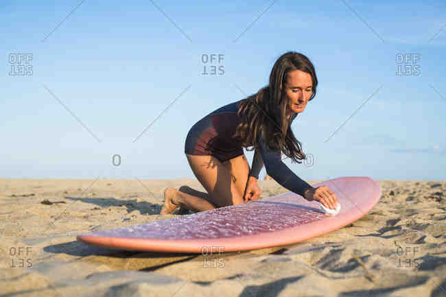 How do you wax a surfboard like a pro?
